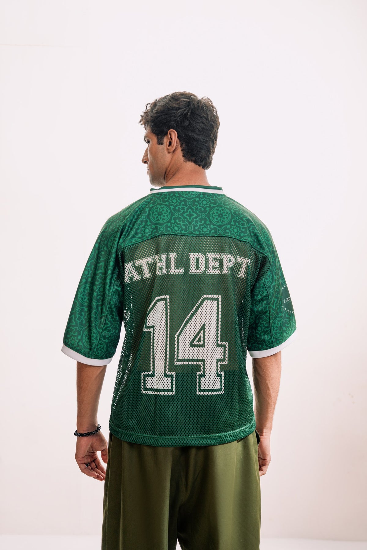 model:male model:studio | Green Passport jersey — back with ATHL DEPT 14, studio
