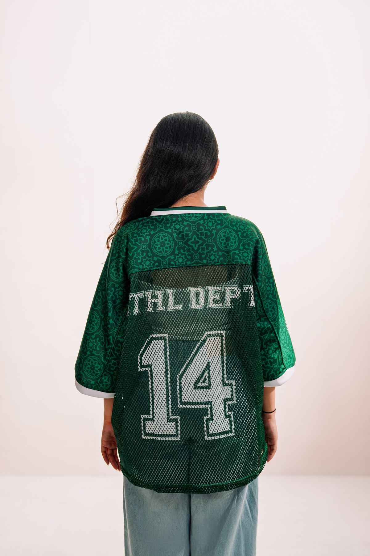 model:female model:studio | Green Passport jersey — back, worn by female model, studio