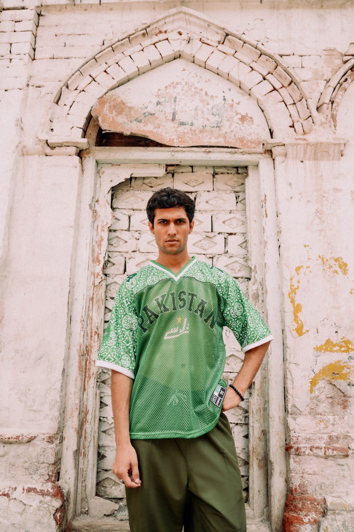 model:male | Pakola Green jersey — front, worn by male model, Lahore campaign