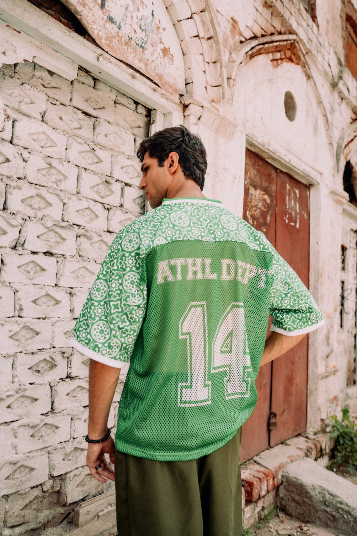 model:male | Pakola Green jersey — back with ATHL DEPT 14, Lahore campaign