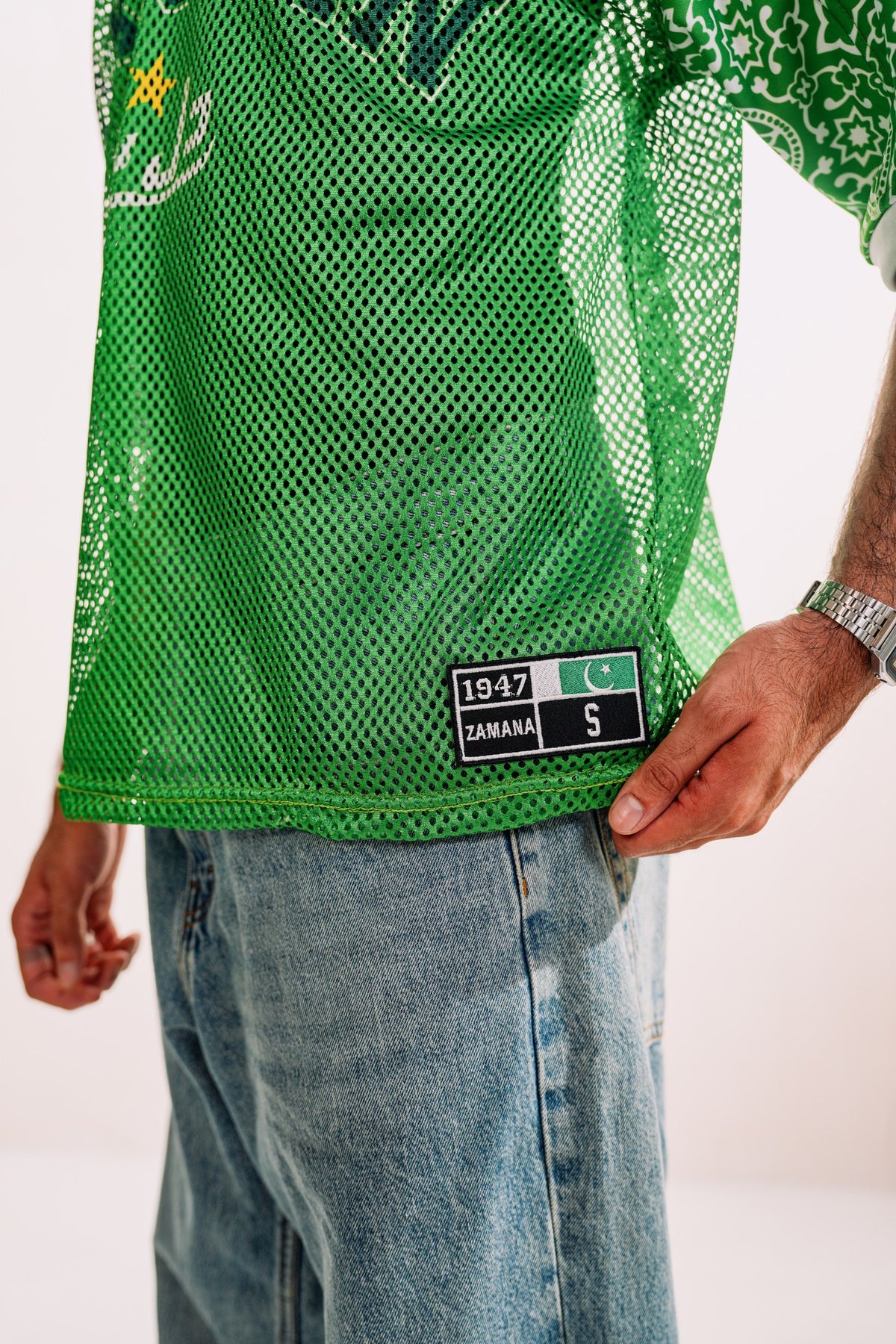 model:detail model:studio | Pakola Green jersey — mesh and 1947 ZAMANA label detail