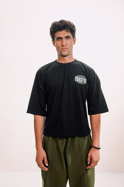 model:male model:studio | Zamana Alumni Tee — front, worn by male model, studio