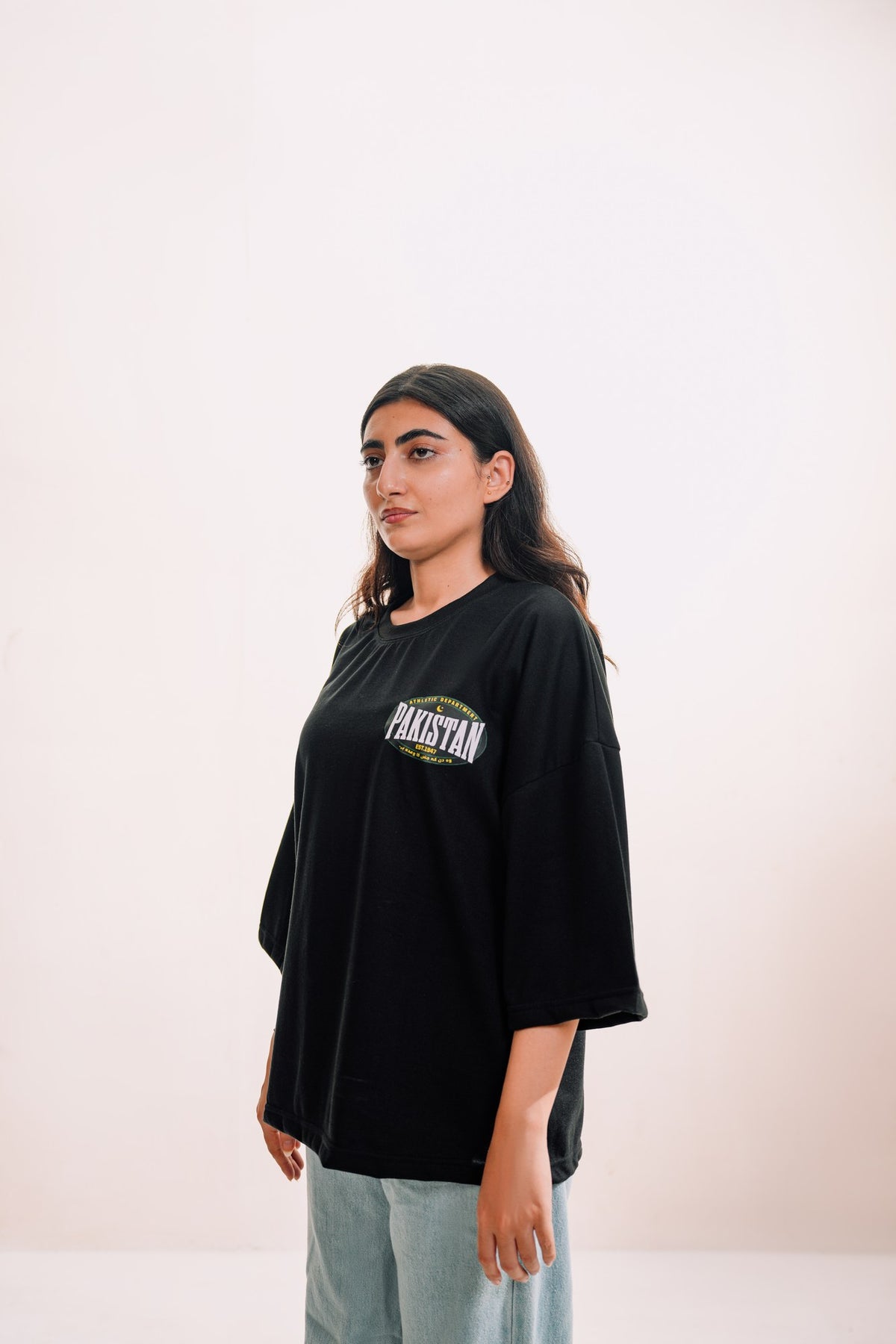 model:female model:studio | Zamana Alumni Tee — three-quarter view, worn by female model, studio